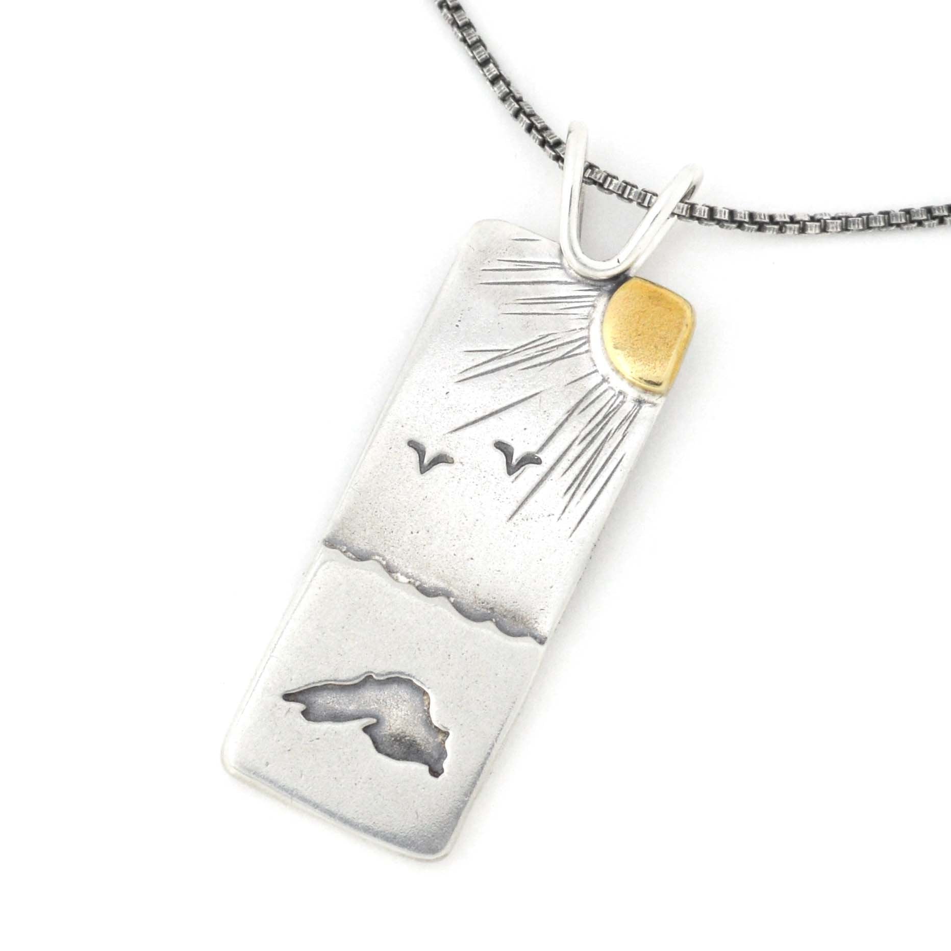 https://www.bethmillner.com/cdn/shop/products/under-the-sun-and-stars-reversible-pendant-mixed-metal-pendant-beth-millner-jewelry-835760_1864x1865.jpg?v=1625506184